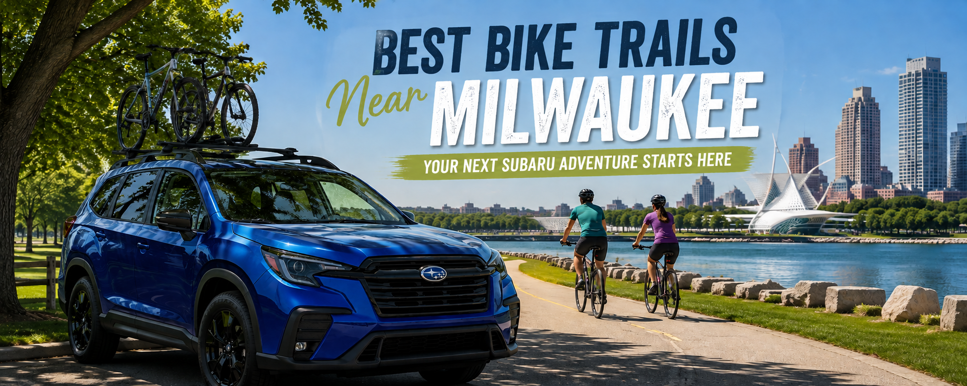 Blue Subaru Ascent parked near a lakeside bike trail while two cyclists ride past