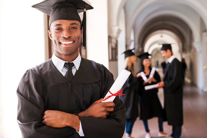 college graduate holding his diploma | Subaru City of Milwaukee in Milwaukee WI