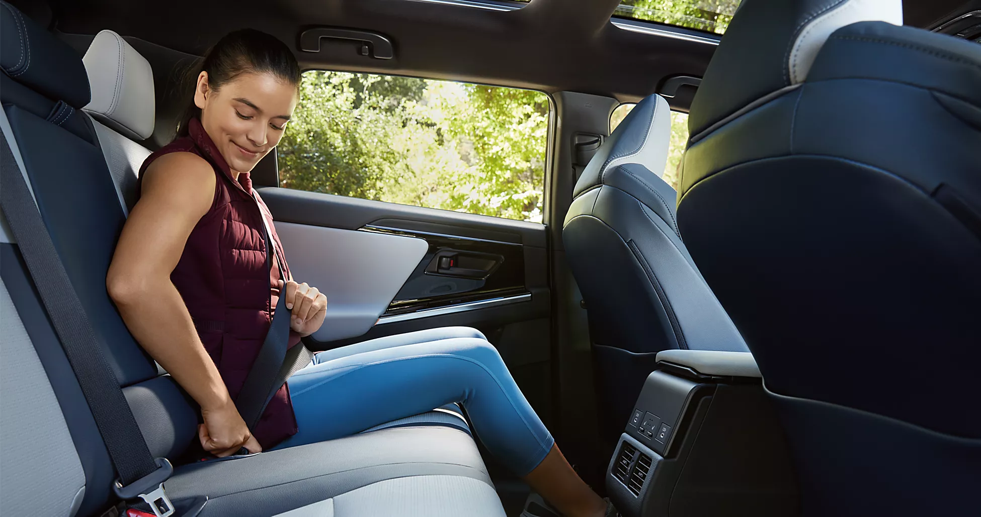 Lady buckling Subaru seatbelt